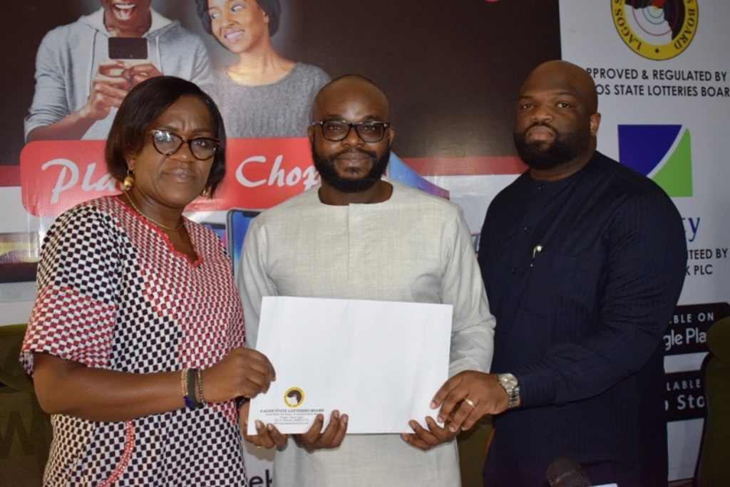 (L-r): Head, Legal, Lagos State Lotteries Board, Mrs. Adebanke Ogunode; co-founders of Ekojara, Hillary Nwaukor and Olayemi Agbe-Davies, respectively, during the presentation of certificate of authorisation to Koborise App Technologies Ltd by Lagos State Lotteries Board at the media launch of Ekojara in Lagos, yesterday